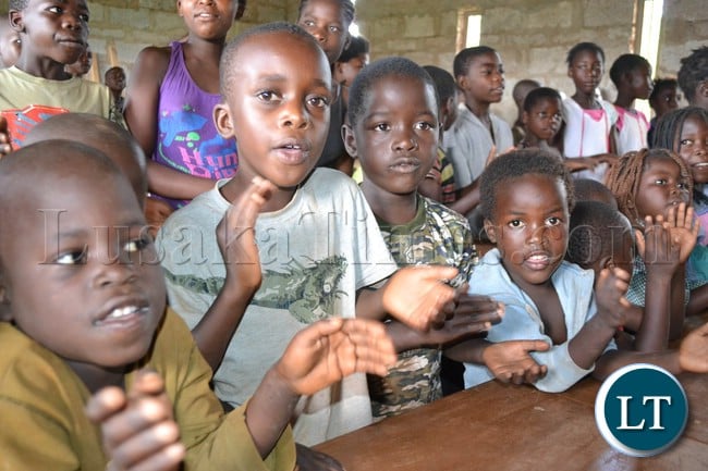 A bright future can be seen spilling out of these children's eyes as the clap in apriciation of the danation of books and desks fron the rotary club of Knwazi