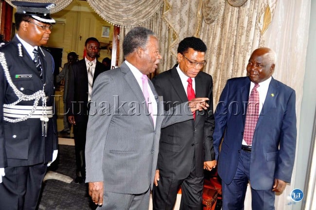 President Michael Chilufya Sata talks to Transport, Communications deputy minister Panji Kaunda (r)  