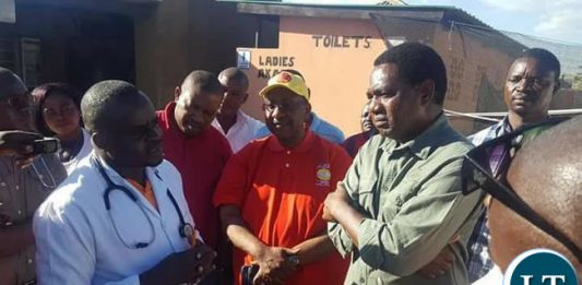 Mr Hichilema and top UPND officials receiving a brief from a Ministry of Health official during the tour of the Cholera centers.